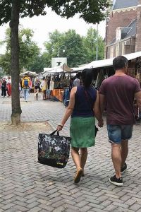 b. Some shopping together at the Noordermarkt.